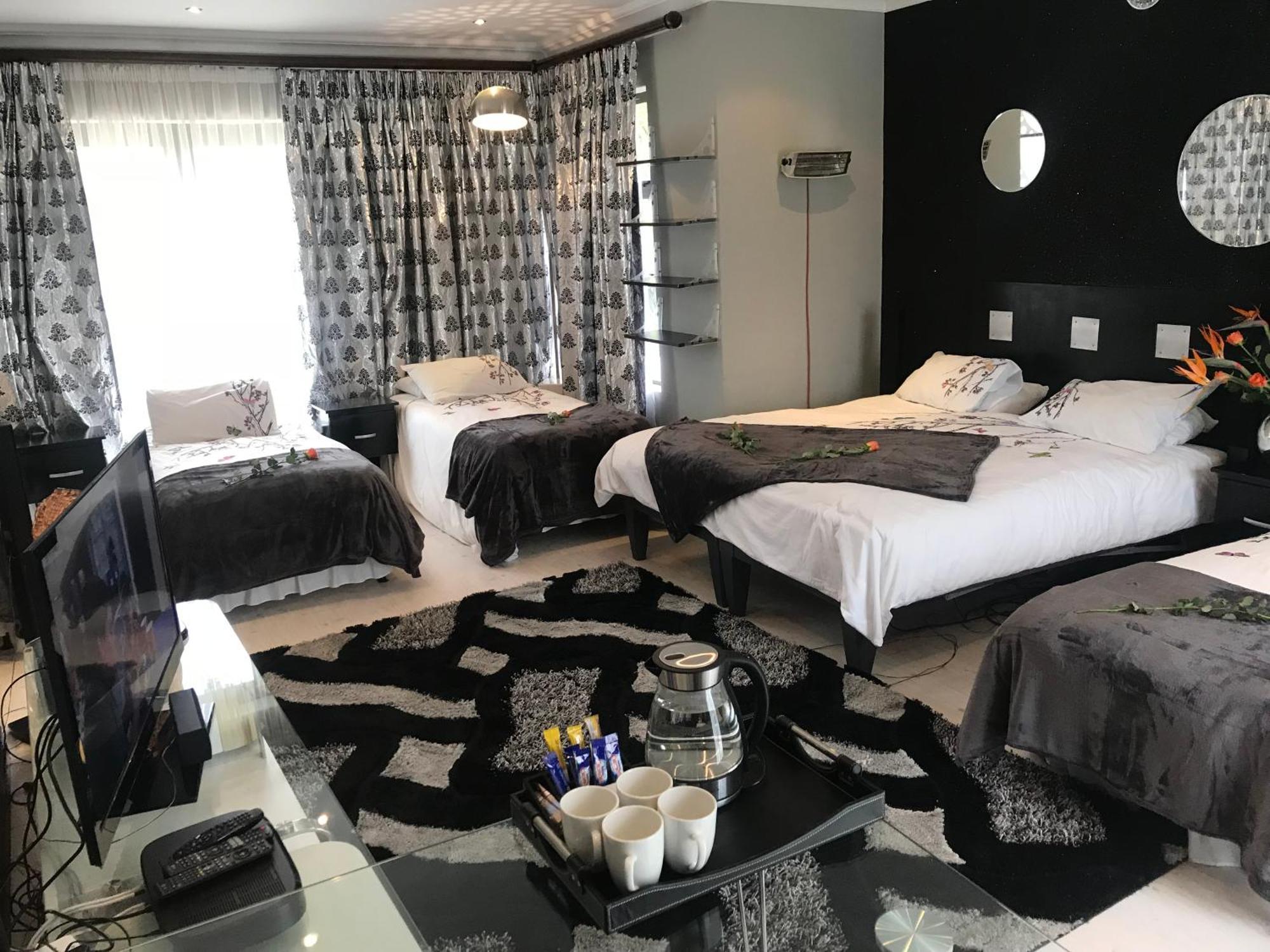 Africa Paradise - Or Tambo Airport Boutique Hotel Беноні Номер фото
